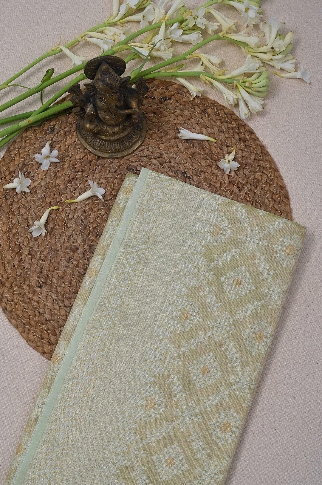 Semi Kora Tissue saree with soft pista green and ivory - handcrafted saree from Semi Kora Tissue Saree collection
